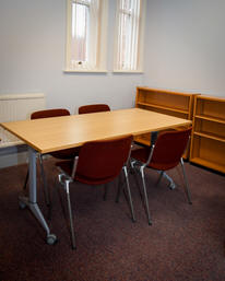 Table and four chairs in a meeting room